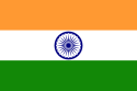 horizontal tricolour flag (deep saffron, white, and green). in the center of the white is a navy blue wheel with 24 spokes.